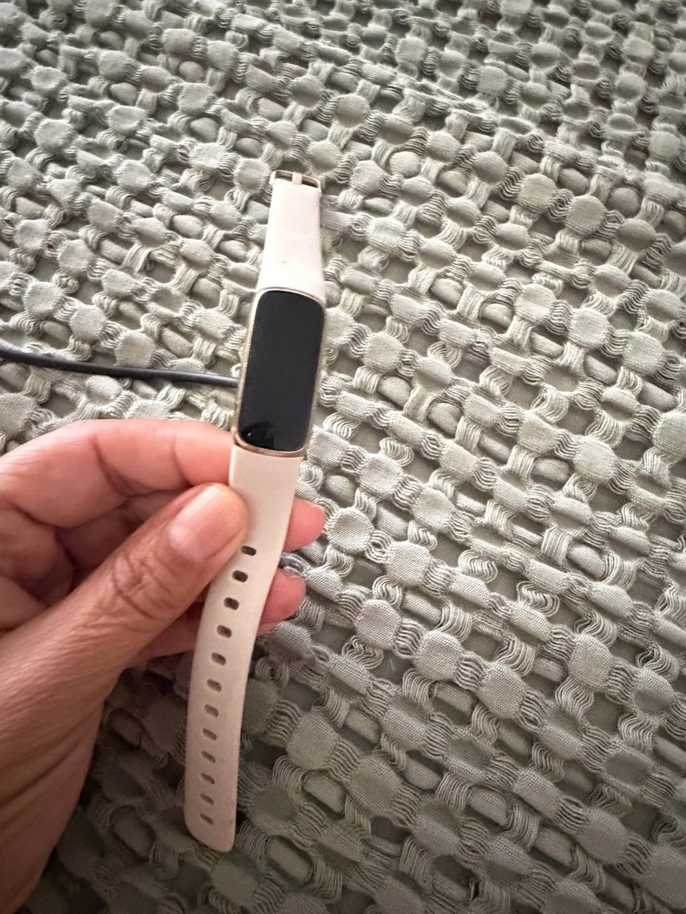 fitbit Slim Tracker with Light Pink Silicone Band needs secure strap - may need.